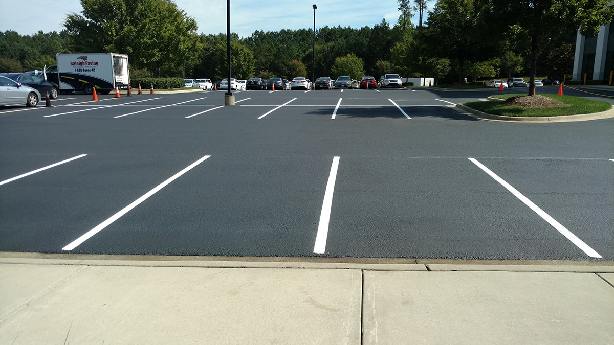A newly seal coated parking lot